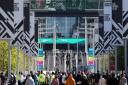 Fans walk along Wembley Way ahead of the Carabao Cup Final at Wembley Stadium on  Sunday April 25, 2021.