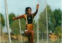 Connie Henry in long jump action