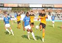 Wealdstone forward Josh Umerah battles for the ball against Eastleigh