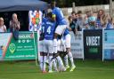 Wealdstone celebrate as Medy Elito scores from the spot against Altrincham