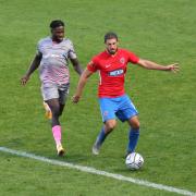 Andrew Eleftheriou of Dagenham and Redbridge and Jacob Mendy of Wealdstone during Dagenham & Redbridge vs Wealdstone, Vanarama National League Football at the Chigwell Construction Stadium on 10th October 2020