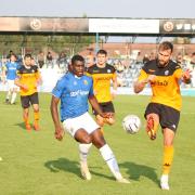 Wealdstone forward Josh Umerah battles for the ball against Eastleigh