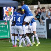 Wealdstone celebrate as Medy Elito scores from the spot against Altrincham