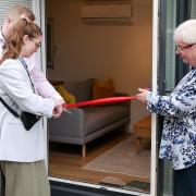 Andrea and Costel who came up with idea for The Cabin, cutting the ribbon with hospice chief executive Sophie Andrews