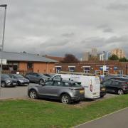 The side view of the Wembley Centre for Health and Care car park and a  side view of the old Wembley Hospital building to be sold