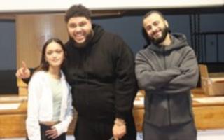 Zuhair Hassan award-winner Rowelyn-Jane Karris, Big Zuu and Hyder Abdullah at St Augustine's High School