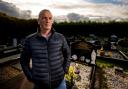 Michael McConville, son of IRA murder victim Jean McConville, at his parents’ grave in Lisburn (Liam McBurney/PA)