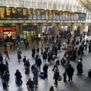 File photo dated 29/03/24 of passengers waiting for trains at London King's Cross Station. A cyber attack has hit public wifi at some of the biggest railways stations in the country, and reports say that Manchester Piccadilly, Birmingham New Street and