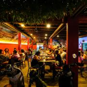 Foreign tourists have a drink at a night club at Nana Backpack hostel in Vang Vieng, Laos (AP/Anupam Nath)