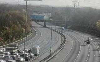 Motorcyclist fighting for life after crash with car on M25